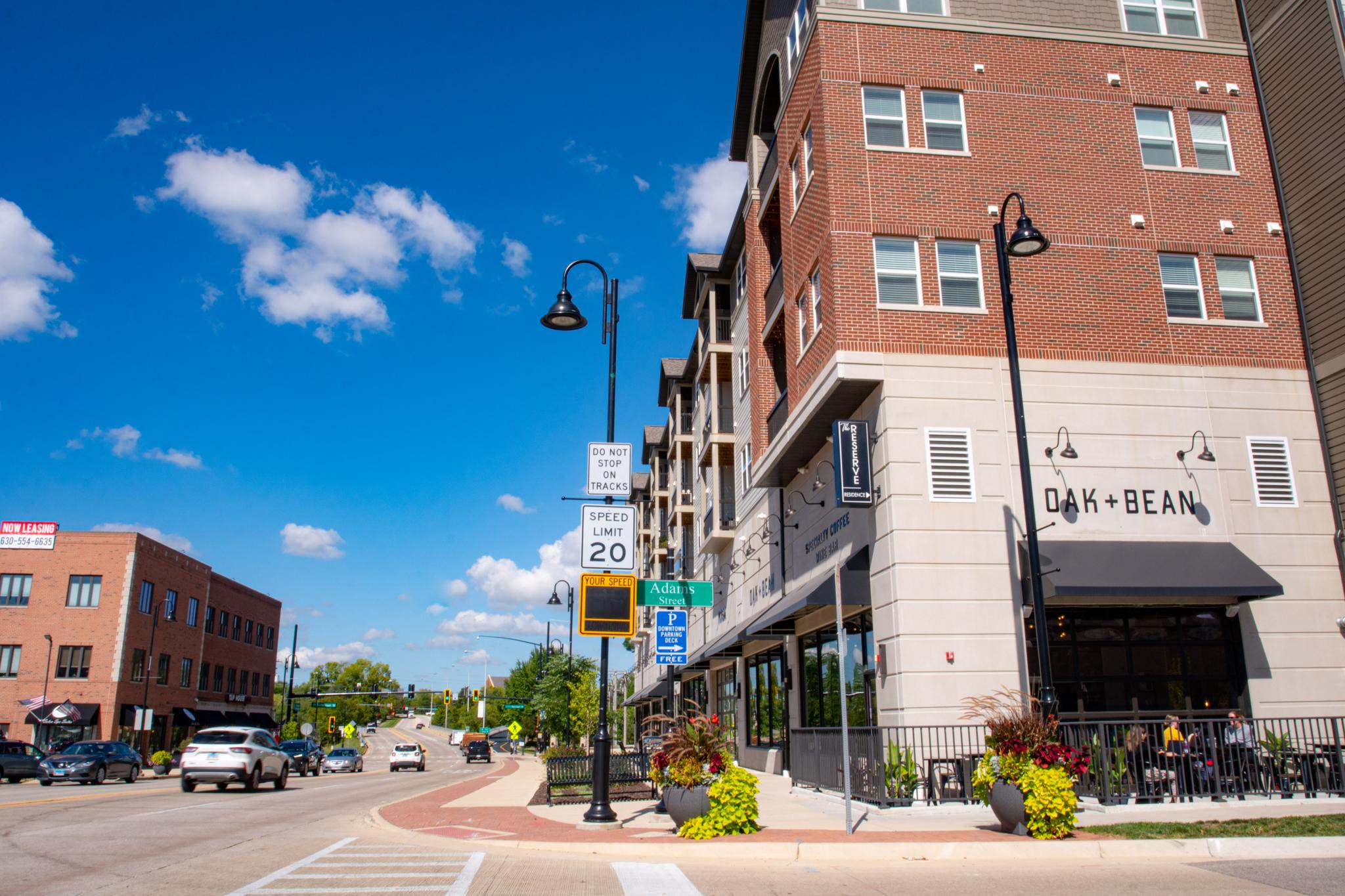 Downtown Oswego streetscape with Oak + Bean coffee shop and local businesses