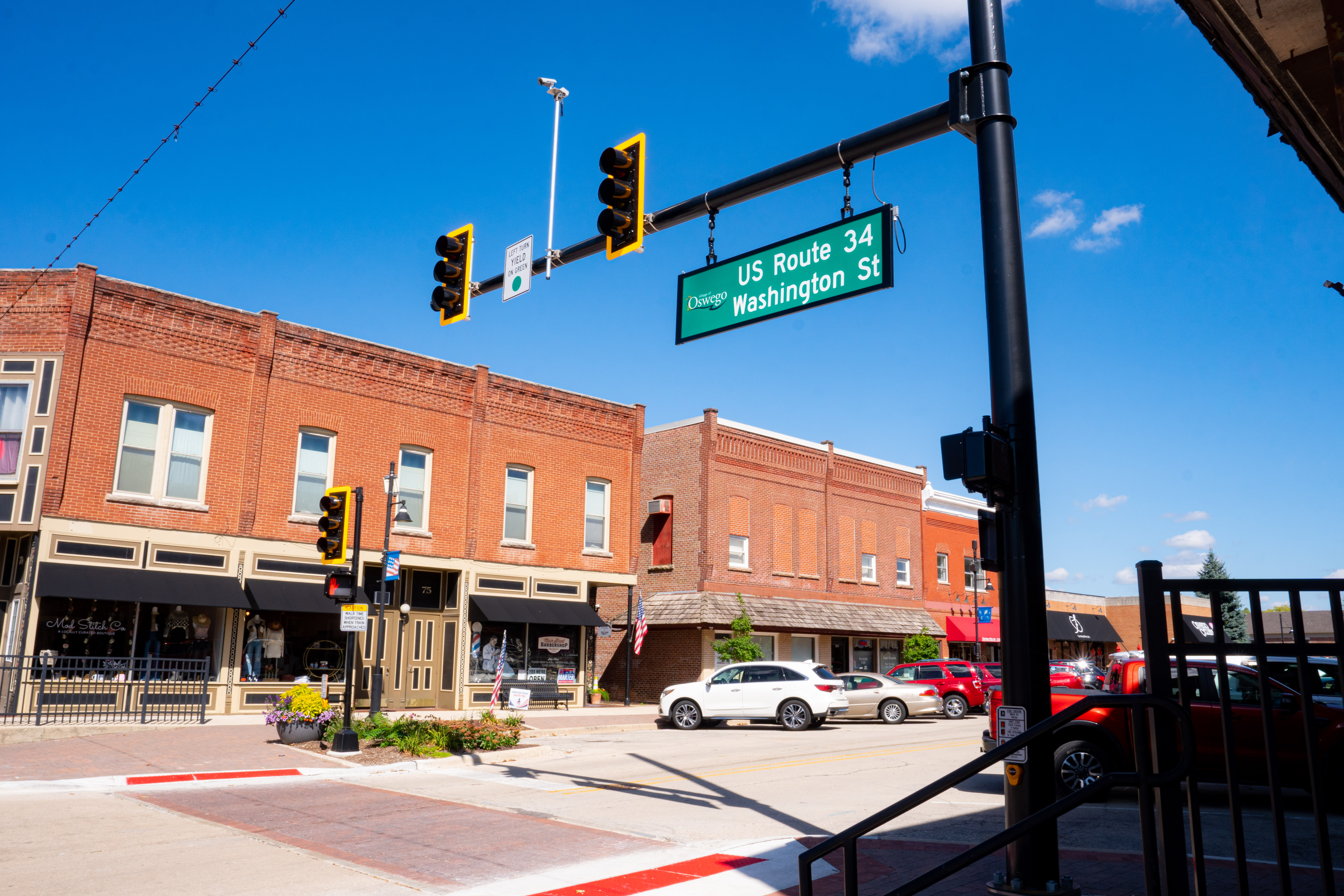 Downtown Oswego storefronts along US Route 34 and Washington Street
